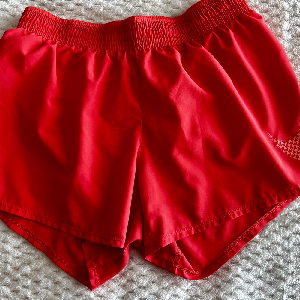 Small Orange Nike Dri-Fit running shorts